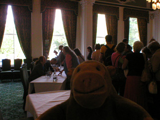 Mr Monkey watching authors sign books