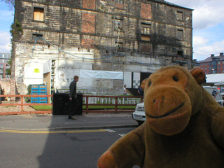 Mr Monkey looking at the empty Oasis from across the road