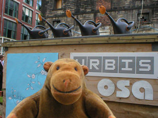 Mr Monkey examining the sign for the Oasis