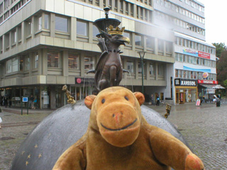 Mr Monkey in front of a griffon on top of a large ball