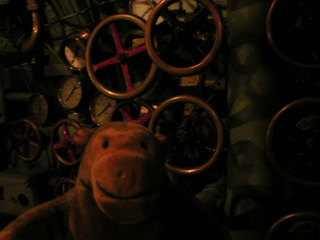 Mr Monkey with a panel of important looking wheels