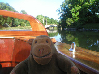 Mr Monkey sailing towards a bridge in the Kungsparken