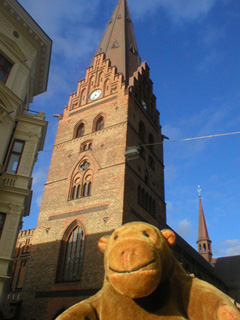 Mr Monkey looking up at St Peter's tower