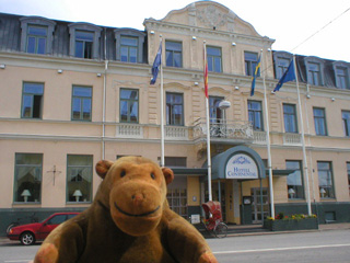 Mr Monkey looking at the Continental Hotel