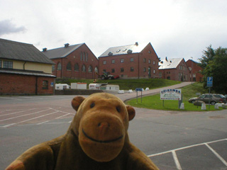 Mr Monkey looking at a variety of barracks buildings