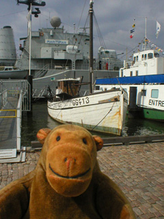 Mr Monkey looking at fishing boat called Gunhild