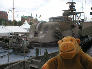 Mr Monkey looking at the Hugin patrol boat from the next boat on