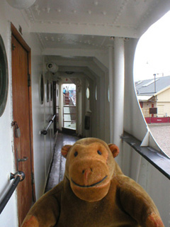 Mr Monkey running along the companionway beside the bridge