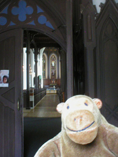 Mr Monkey looking through the main doors of the Hagakyrkan