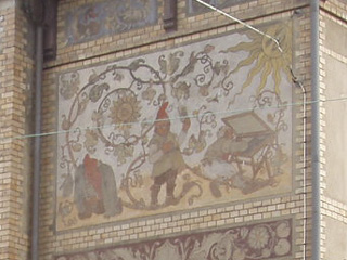 Elves painted on the wall of a house on Vasagatan