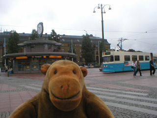 Mr Monkey watching out from trams in Drottningtorget