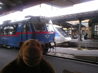Mr Monkey looking at trains in Gothenburg station