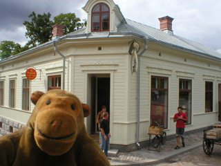 Mr Monkey in front of the ironmongers shop