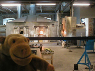 Mr Monkey looking at glass furnaces from a distance