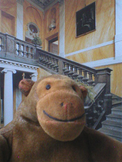 Mr Monkey in front of a picture of the Steninge stairwell