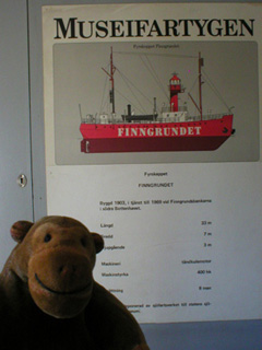 Mr Monkey lookinging at an information panel