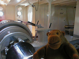 Mr Monkey examining machinery inside the Finngrundet
