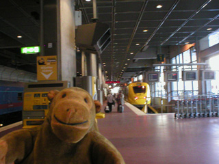 Mr Monkey in front of the Arlanda Express platform