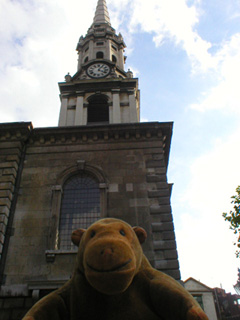 Mr Monkey looking up at St Giles spire