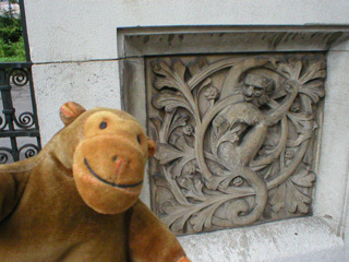 Mr Monkey examining another carved monkey