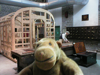 Mr Monkey looking at the carpentry shop