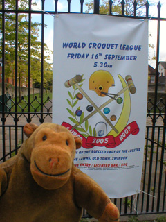 Mr Monkey looking at a Superhoop banner