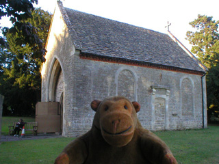 Mr Monkey looking at a ruined chapel