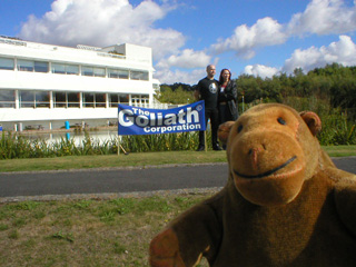 Mr Monkey looking at the temporary sign outside the Goliath Corporation