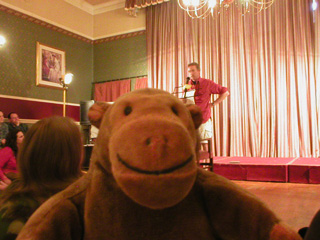 Mr Monkey watching a reading by Jasper Fforde