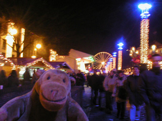 Mr Monkey walking through a Christmas market