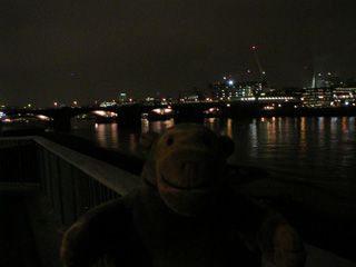 Mr Monkey looking at Blackfriars Bridge in the dark
