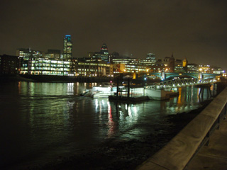 A catamaran docking at the Bankside floating pier