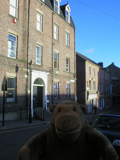 Mr Monkey looking at a Georgian house