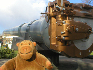 Mr Monkey examining the naval guns outside the museum