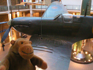 Mr Monkey looking at a Mk1 Spitfire