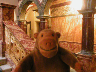 Mr Monkey on the marble main stairs of the Russell Hotel