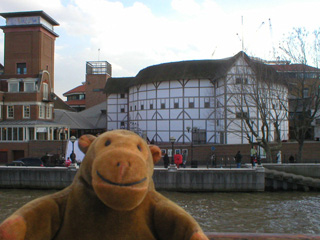 Mr Monkey looking at the Globe Theatre from Bankside jetty