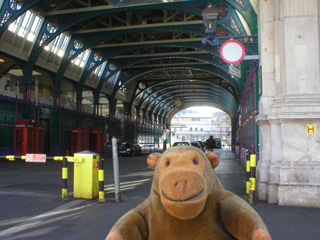 Mr Monkey looking at the main arcade of Smithfields market