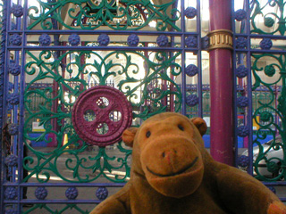 Mr Monkey examining the ironwork of the Smithfields market