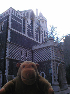 Mr Monkey passing the side of St Bartholomew the Great