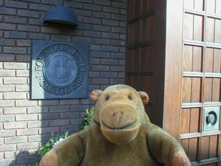 Mr Monkey outside the door of Founders Hall