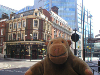 Mr Monkey looking at the Kings Head on the corner of Chiswell Street