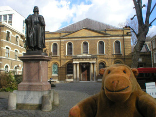 Mr Monkey outside Wesley's house and chapel