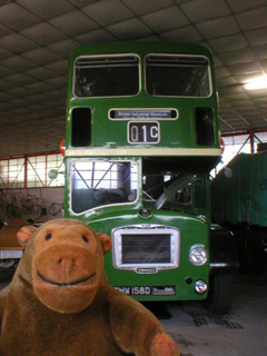 Mr Monkey in front of a Bristol Lodekka FLF6B bus