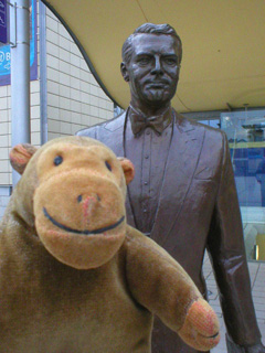 Mr Monkey with a statue of Cary Grant