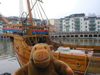 Mr Monkey examining the front of the Matthew from the quay