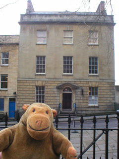 Mr Monkey looking at the front of the Georgian House
