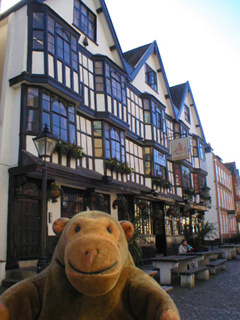 Mr Monkey walking past the Llandoger Trow