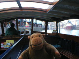 Mr Monkey looking through the front of the ferry approaching Bordeaux Quay