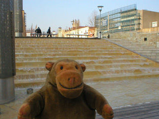 Mr Monkey looking at the water cascade next to the ferry stop